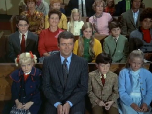 The Bradys looking a mite uncomfortable for Christmas