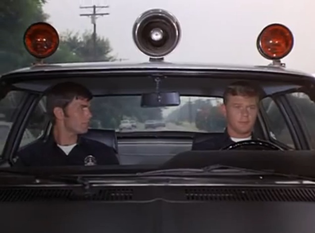"1-Adam-12, 1-Adam-12. See the post at Bionic Disco. A disturbance." (Kent McCord & Martin Milner, 1973)
