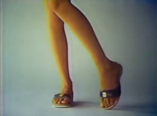 She's got...sandals...and she knows how to use 'em (Scholl commercial, 1977)