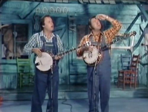 Buck Trent and Roy Clark watching the notes fly on 'Hee Haw,' 1975