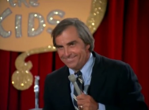 Monty Marshall (Edward Knight), host of 'Question The Kids,' 1973